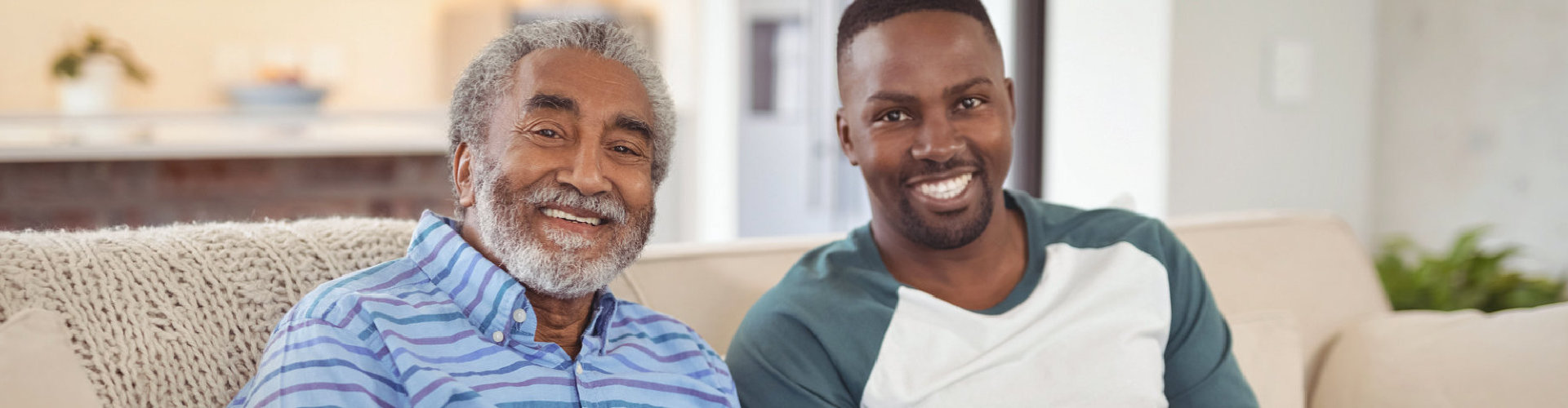 adult man and senior man smiling